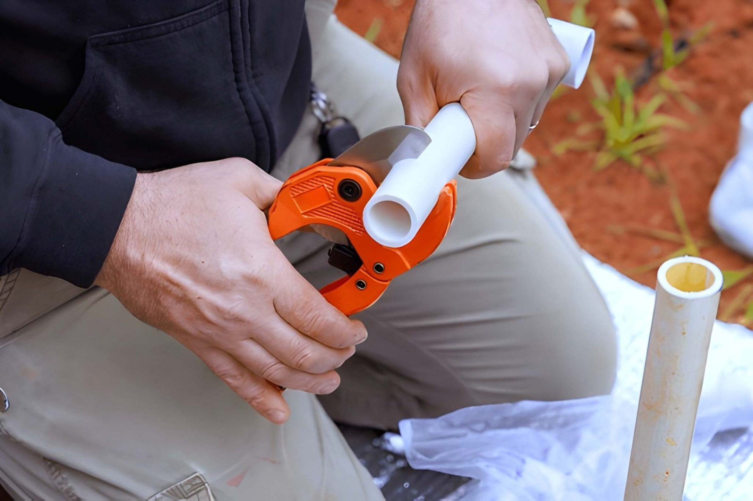 Professional plumber cleaning a blocked drain in Dubai