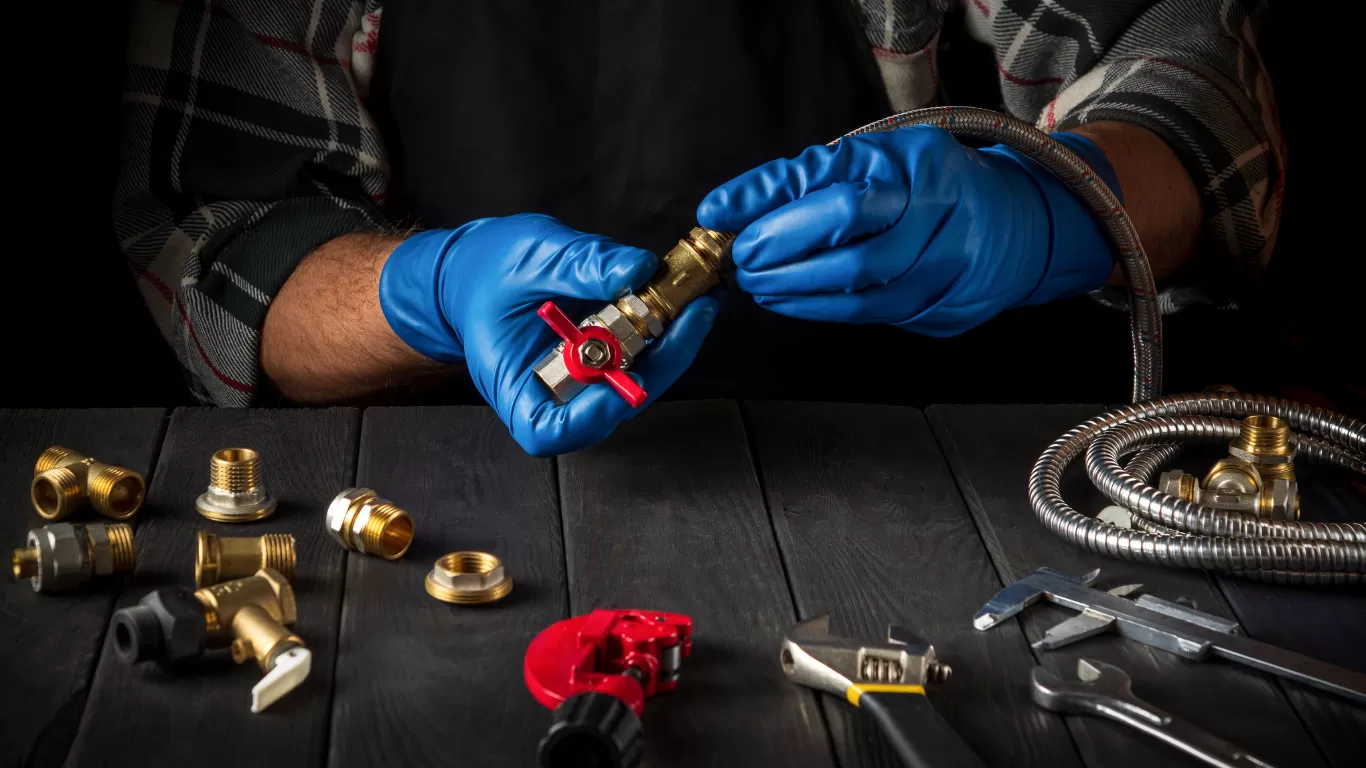 Expert plumber repairing and installing water pipes in Dubai